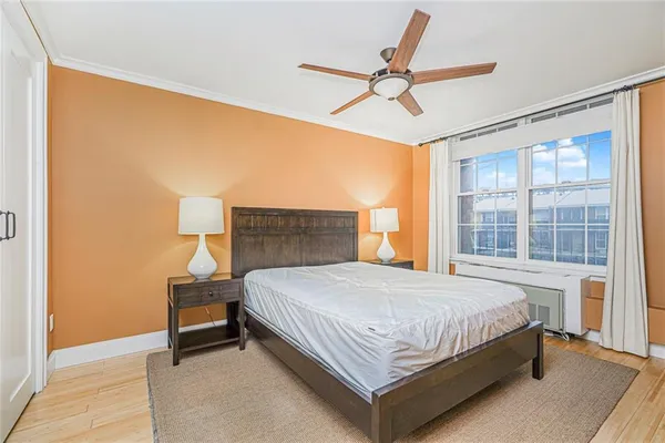 a bedroom with a bed and window