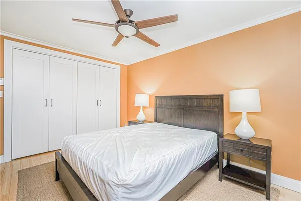 a bedroom with a bed and a lamp