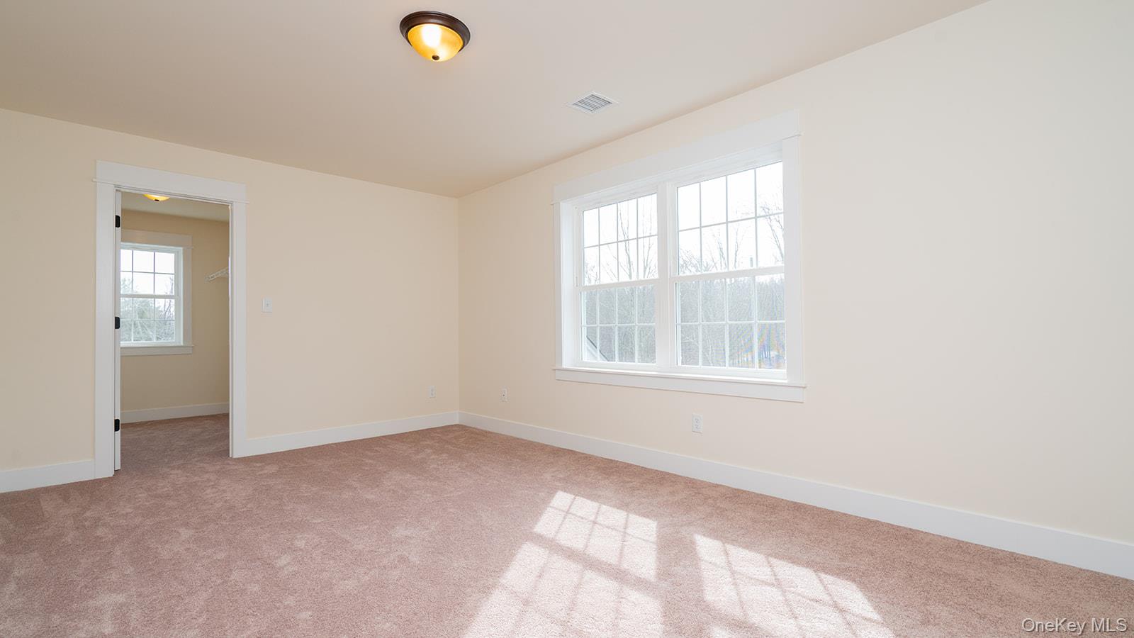 43 Malloy Road Wallkill, NY 12589 - Photo 30 of 50 Unfurnished room with baseboards and light carpet