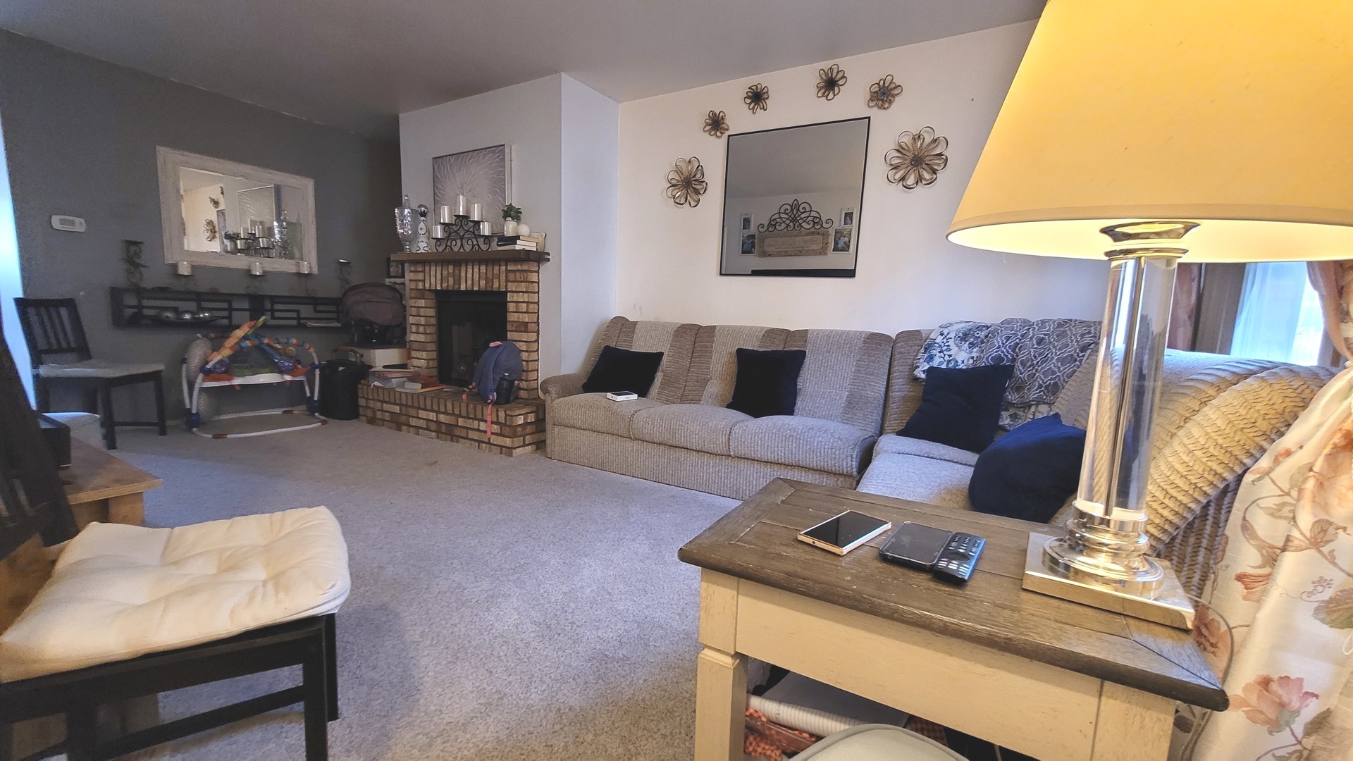 1799 Bristol Walk Hoffman Estates, IL 60169 - Photo 2 of 10 a living room with furniture and a lamp
