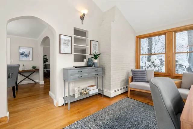 a bedroom with furniture and a wooden floor