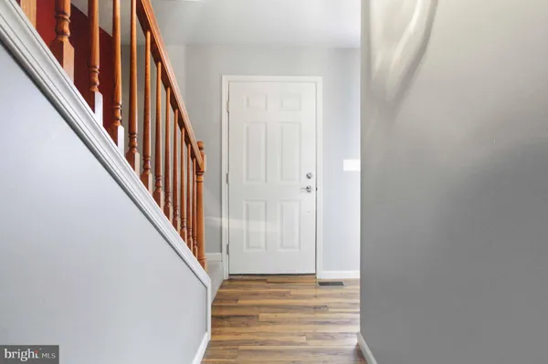 a view of a hallway with stairs