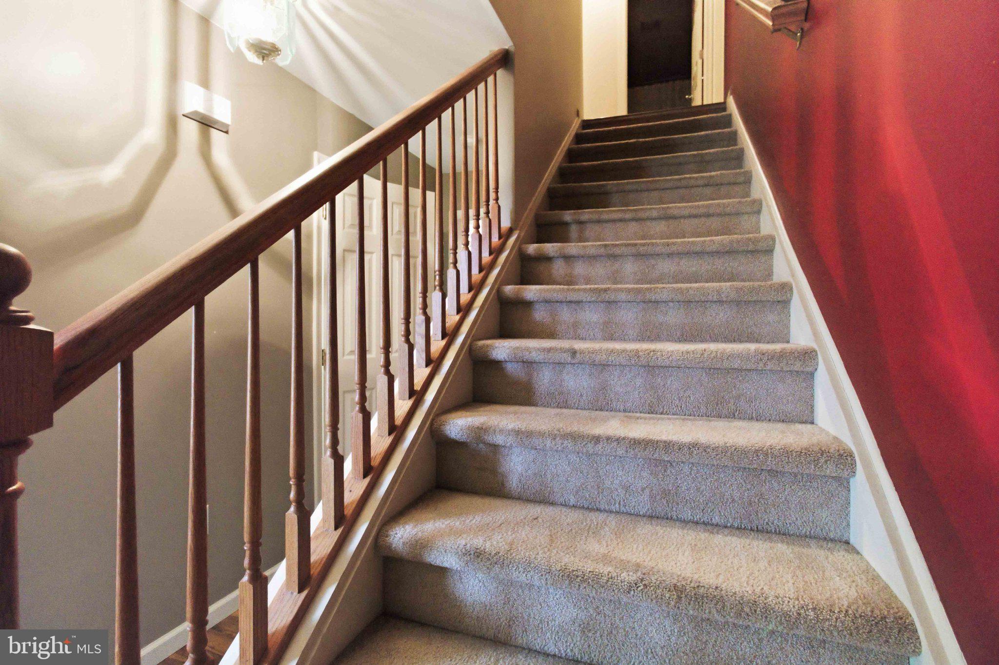 4 Grouse Road Dillsburg, PA 17019 - Photo 15 of 40 a view of staircase with lots of frames on wall
