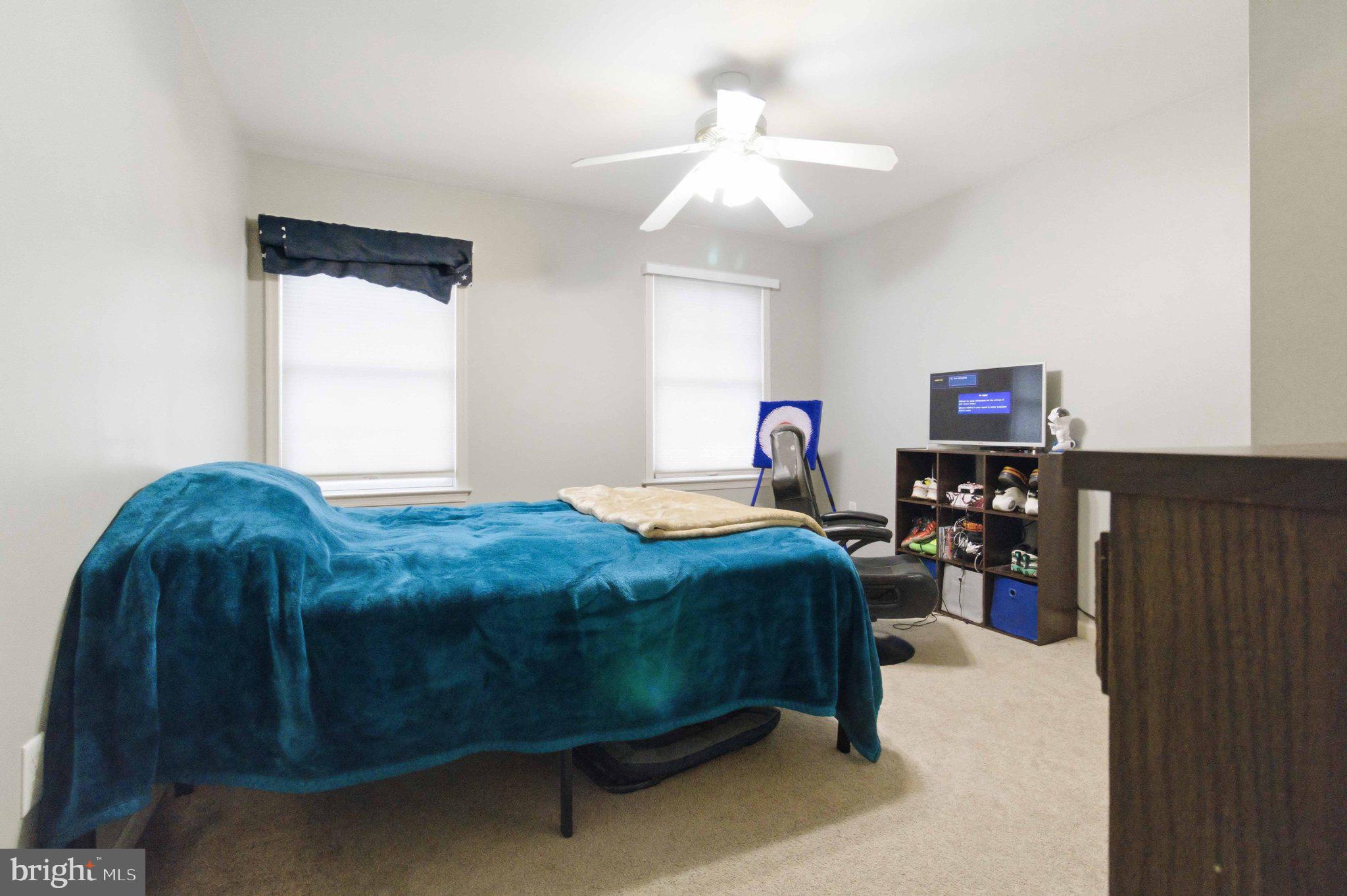 4 Grouse Road Dillsburg, PA 17019 - Photo 25 of 40 a bedroom with a bed and a chandelier