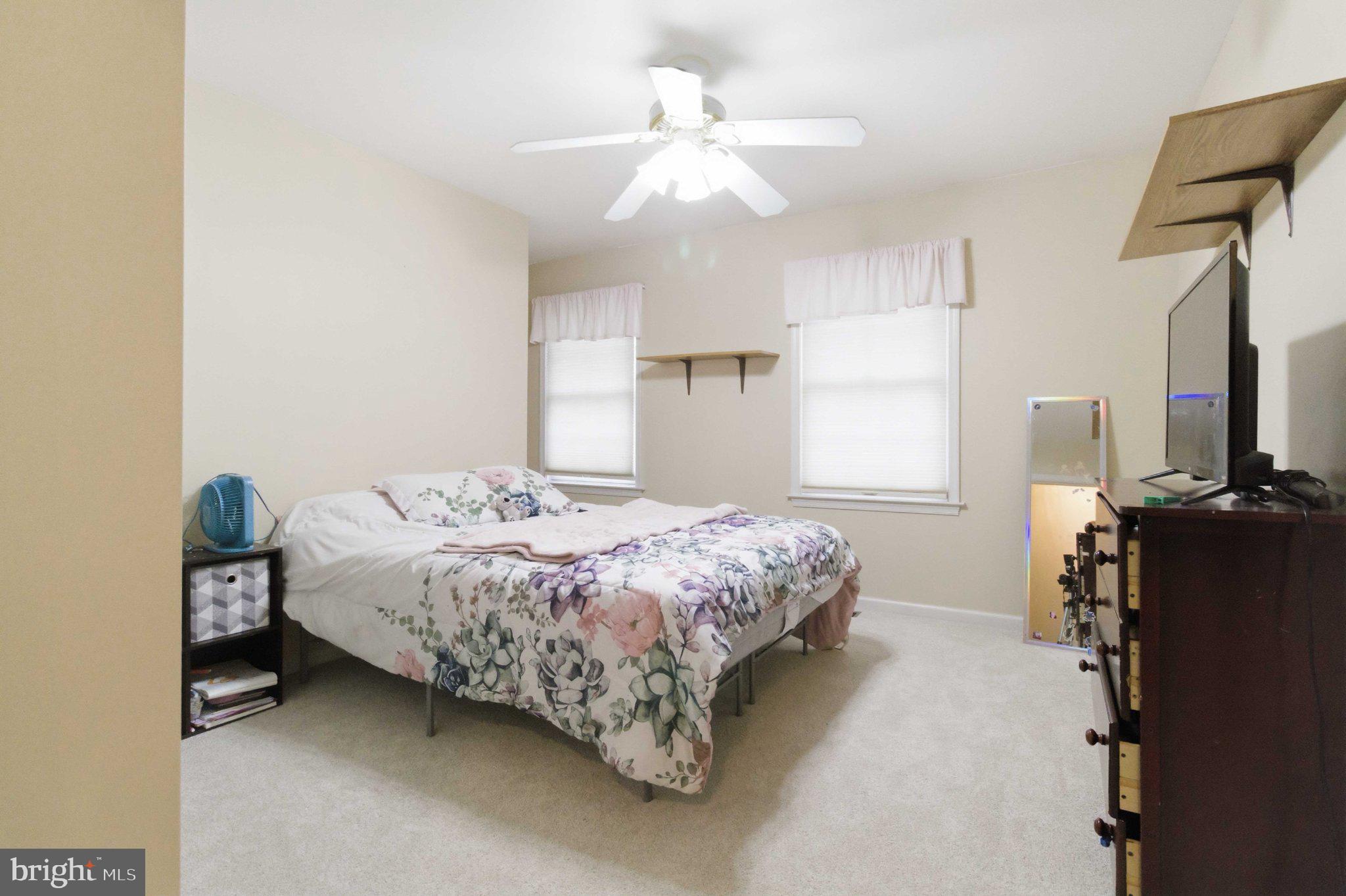 4 Grouse Road Dillsburg, PA 17019 - Photo 26 of 40 a bedroom with a bed and a chandelier