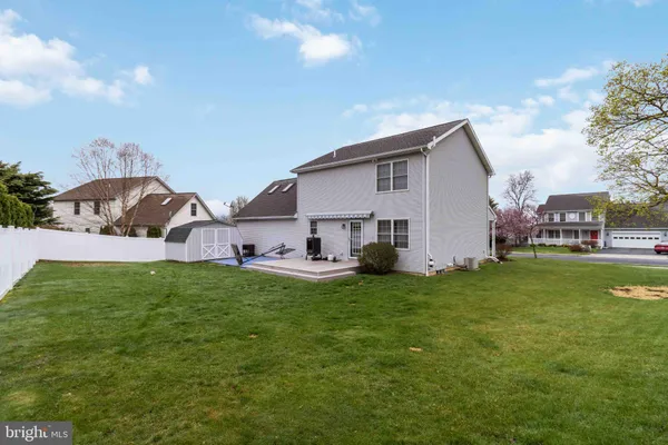 a view of a house with a back yard