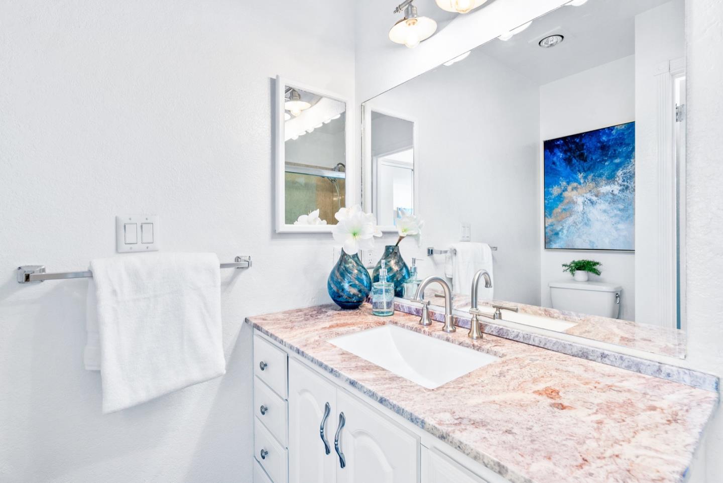 2863 South Bascom Avenue, Unit 804 Campbell, CA 95008 - Photo 18 of 28 a bathroom with a granite countertop sink and a mirror