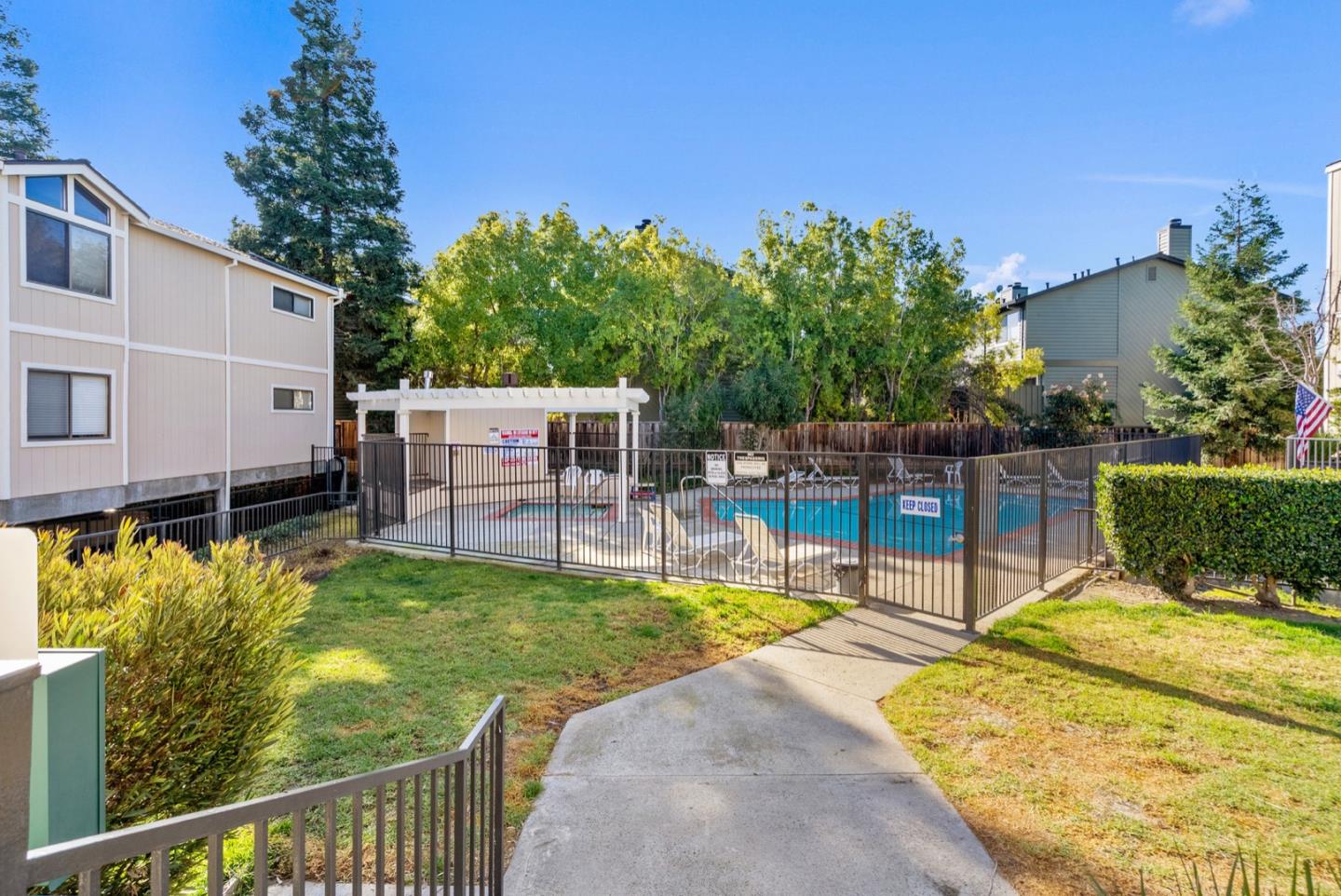 2863 South Bascom Avenue, Unit 804 Campbell, CA 95008 - Photo 24 of 28 a view of a swimming pool with a garden