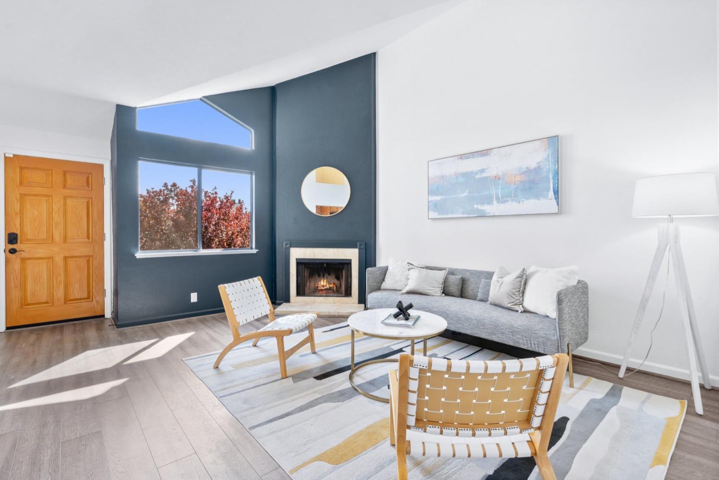 2863 South Bascom Avenue, Unit 804 Campbell, CA 95008 - Photo 4 of 28 a living room with furniture a rug and a fireplace