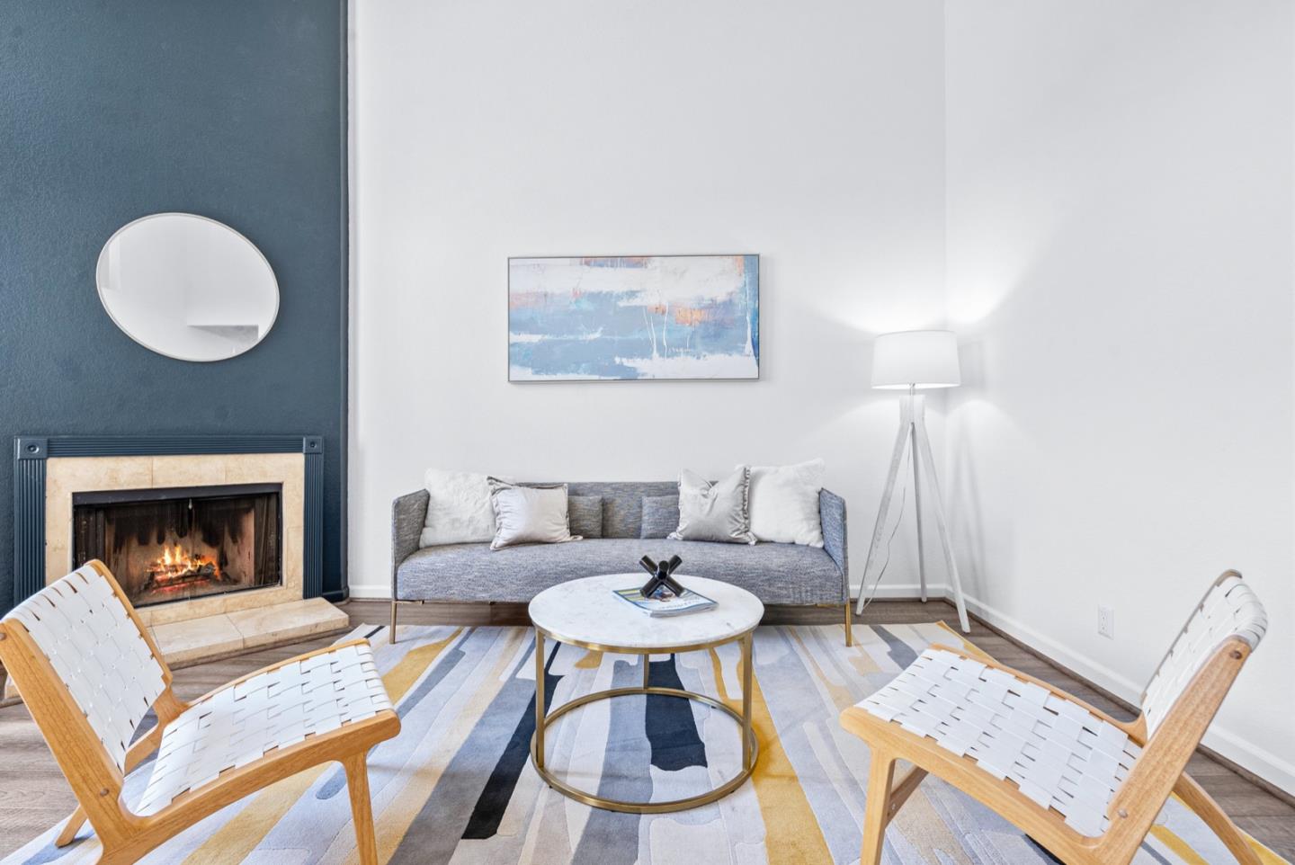 2863 South Bascom Avenue, Unit 804 Campbell, CA 95008 - Photo 5 of 28 a living room with furniture a fireplace and a table