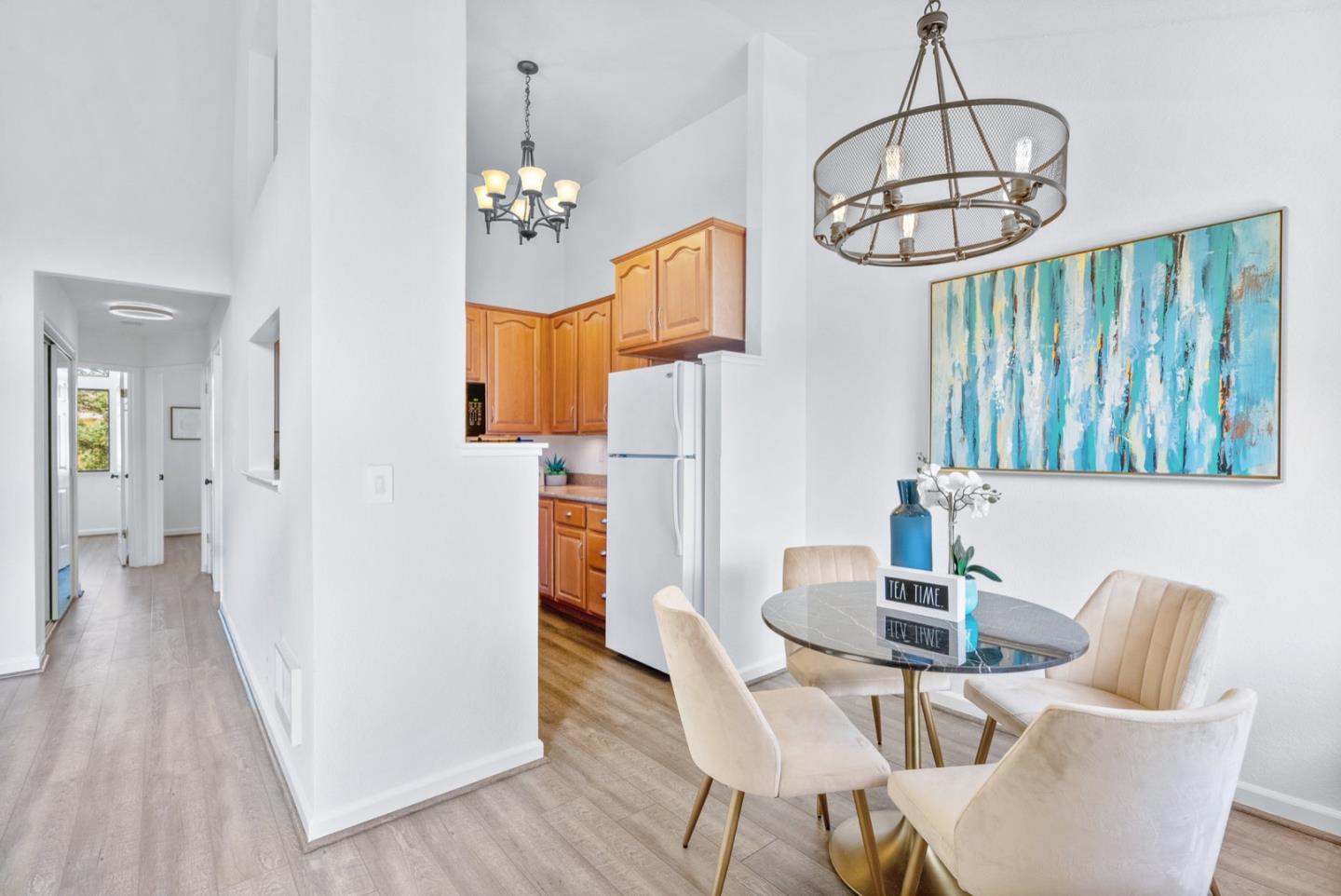 2863 South Bascom Avenue, Unit 804 Campbell, CA 95008 - Photo 8 of 28 a view of a dining room with furniture wooden floor and chandelier