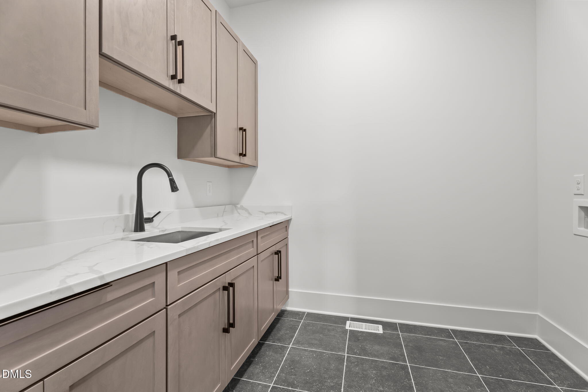 200 Broadleaf Lane Louisburg, NC 27549 - Photo 40 of 57 a kitchen with a sink and cabinets