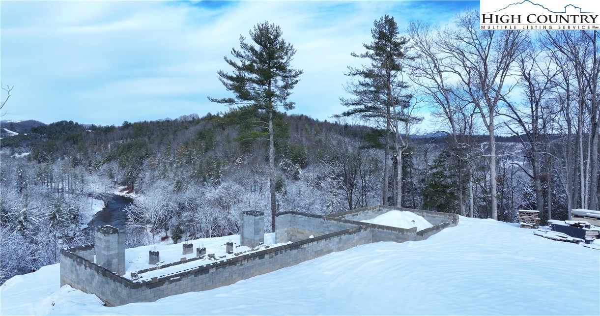 485 Autumn Leaf Way Crumpler, NC 28617 - Photo 13 of 40 a view of a wooden fence with a bench