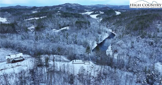 a view of a terrace with a bench and trees