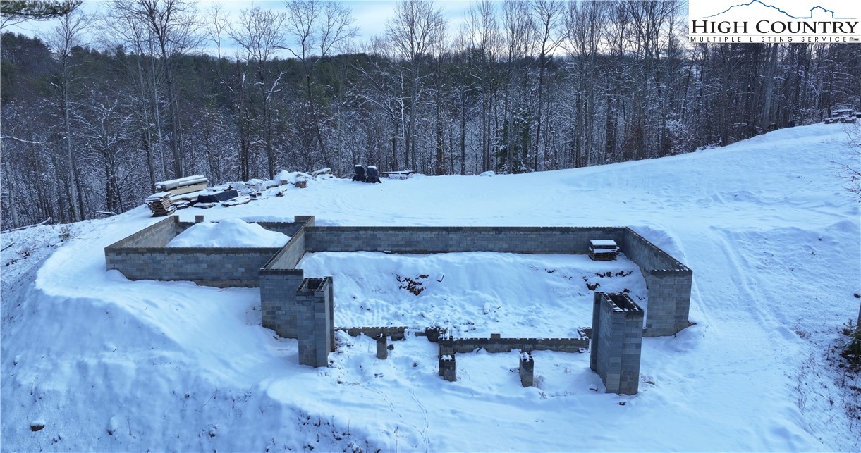485 Autumn Leaf Way Crumpler, NC 28617 - Photo 17 of 40 a view of a table and chairs in the patio