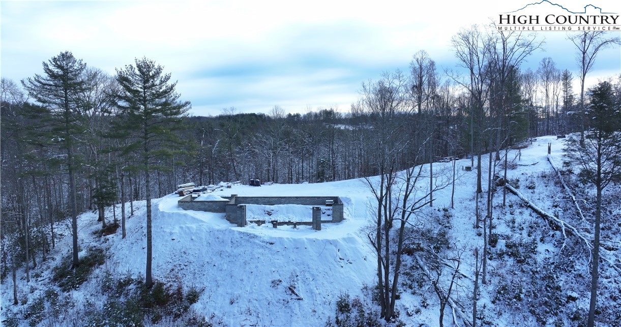 485 Autumn Leaf Way Crumpler, NC 28617 - Photo 27 of 40 a view of a backyard with sitting area