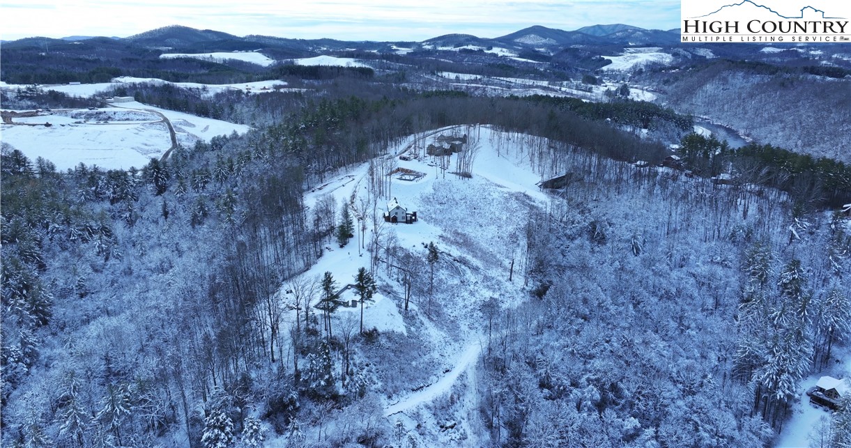 485 Autumn Leaf Way Crumpler, NC 28617 - Photo 37 of 40 a view of a lake with mountains in the background