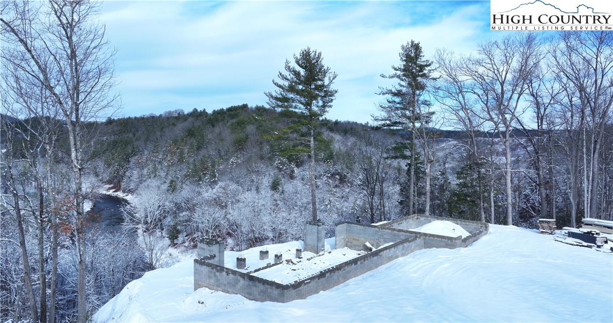 485 Autumn Leaf Way Crumpler, NC 28617 - Photo 10 of 40 a view of a backyard with sitting area