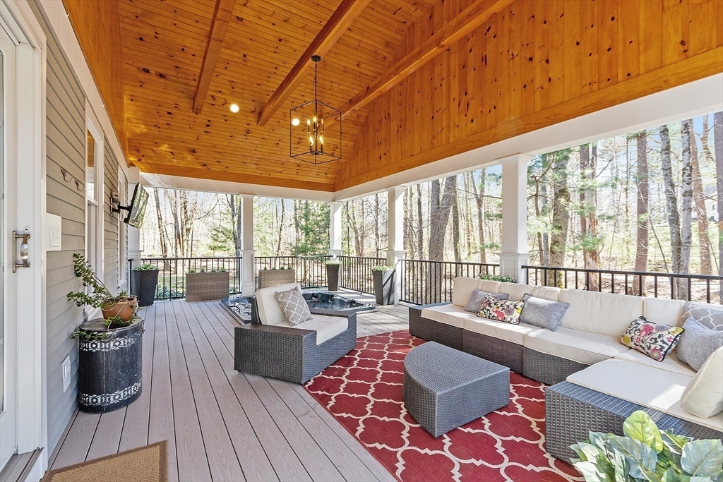 142 Pope Road Acton, MA 01720 - Photo 20 of 42 a living room with furniture and a large window