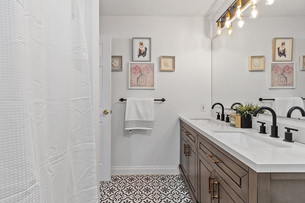 142 Pope Road Acton, MA 01720 - Photo 32 of 42 a bathroom with a sink and a mirror