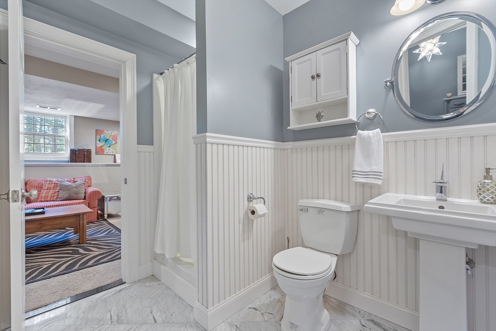142 Pope Road Acton, MA 01720 - Photo 36 of 42 a bathroom with a toilet a sink and a mirror