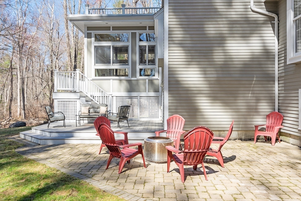142 Pope Road Acton, MA 01720 - Photo 38 of 42 a view of a patio with couple of chairs