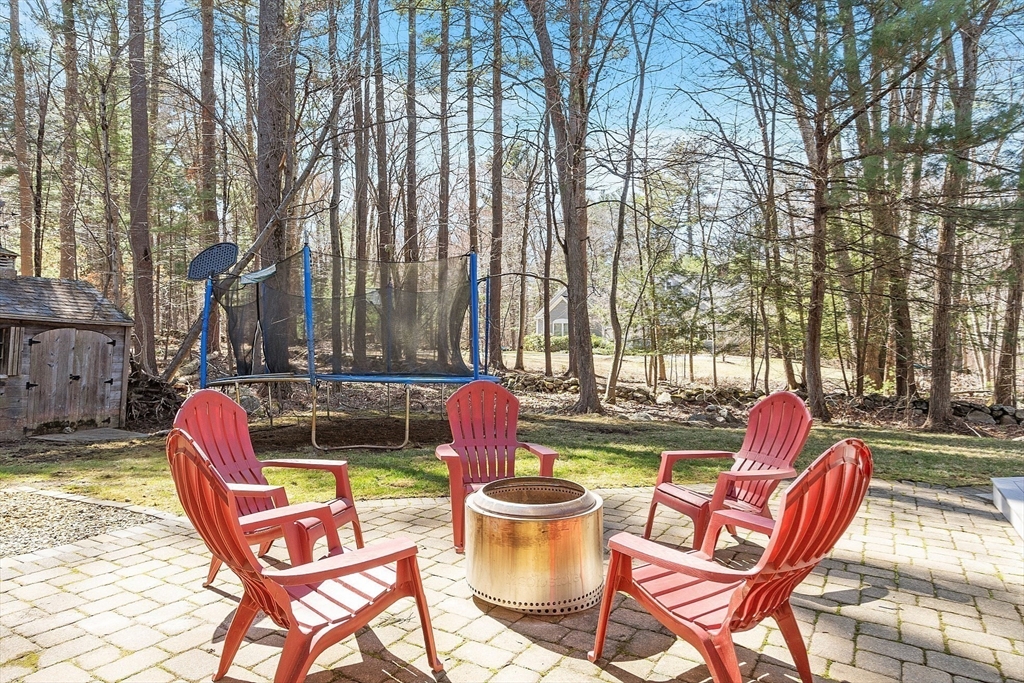 142 Pope Road Acton, MA 01720 - Photo 39 of 42 a backyard of a house with outdoor seating