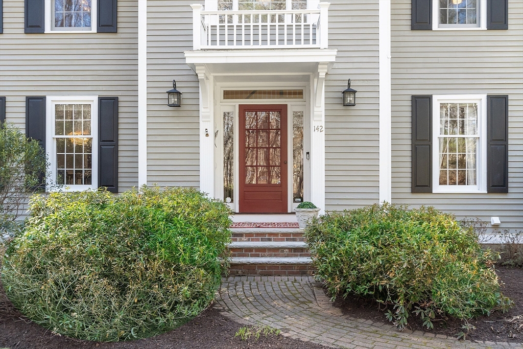 142 Pope Road Acton, MA 01720 - Photo 4 of 42 a front view of a house with plants