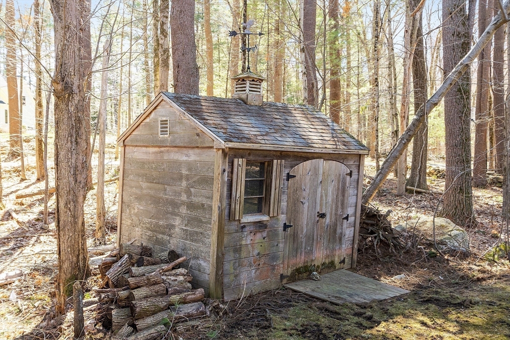142 Pope Road Acton, MA 01720 - Photo 41 of 42 a view of a house with a small yard and wooden fence