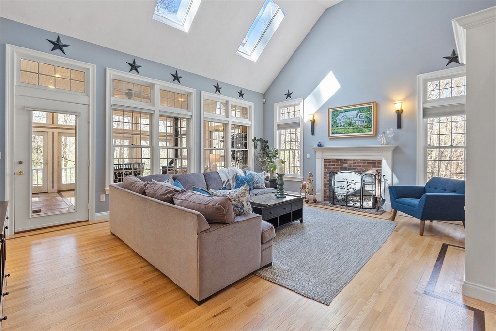 142 Pope Road Acton, MA 01720 - Photo 7 of 42 a living room with furniture and a fireplace