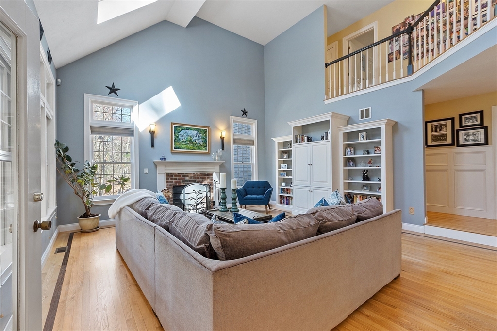 142 Pope Road Acton, MA 01720 - Photo 8 of 42 a living room with furniture and a fireplace