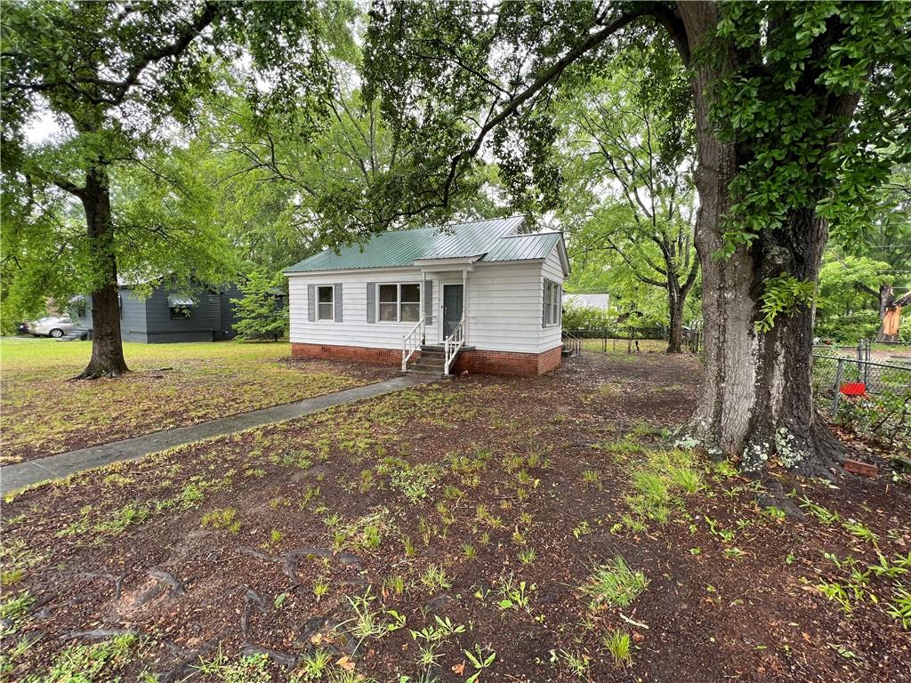 540 East 2nd Street Northeast Rome, GA 30161 - Photo 1 of 1 a house with trees in the background