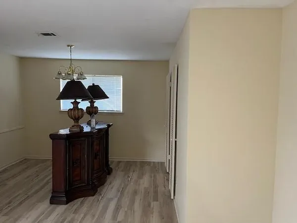 a view of entryway with wooden floor