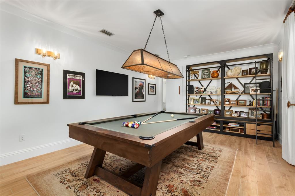 1819 Chadwick Road Englewood, FL 34223 - Photo 50 of 90 a room with furniture pool table and flat screen tv