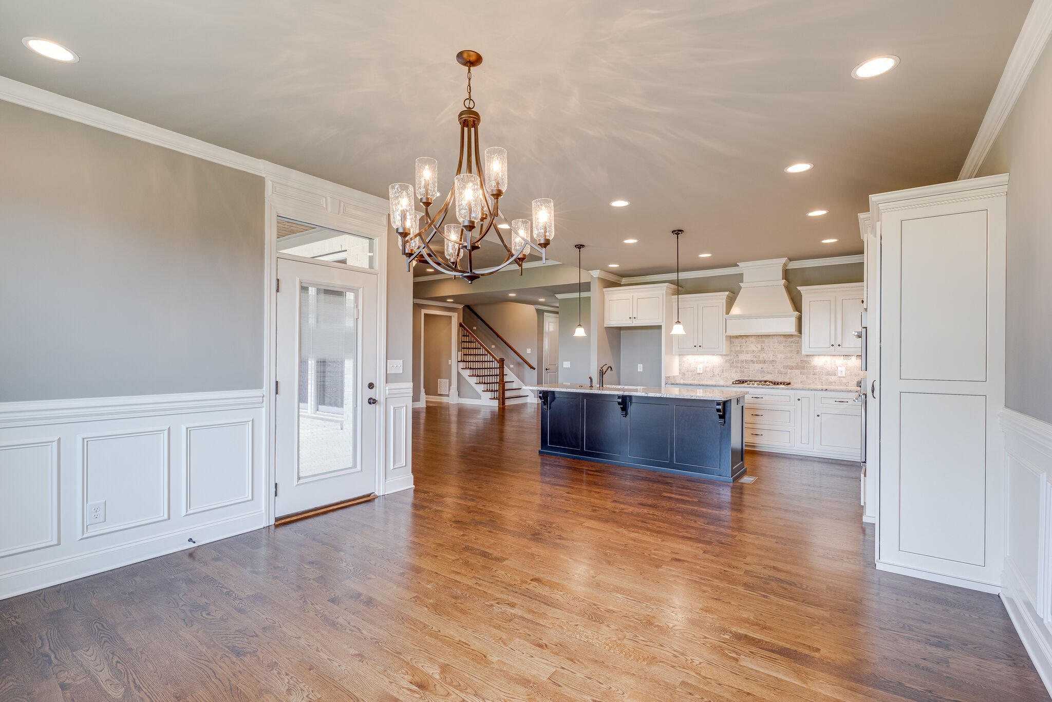 1029 Abbey Rd Way Spring Hill, TN 37174 - Photo 20 of 51 a view of a kitchen and dining room with wooden floor