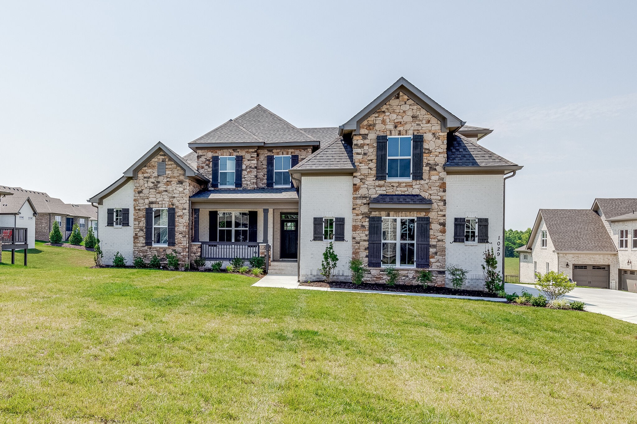 1029 Abbey Rd Way Spring Hill, TN 37174 - Photo 2 of 51 a front view of a house with garden