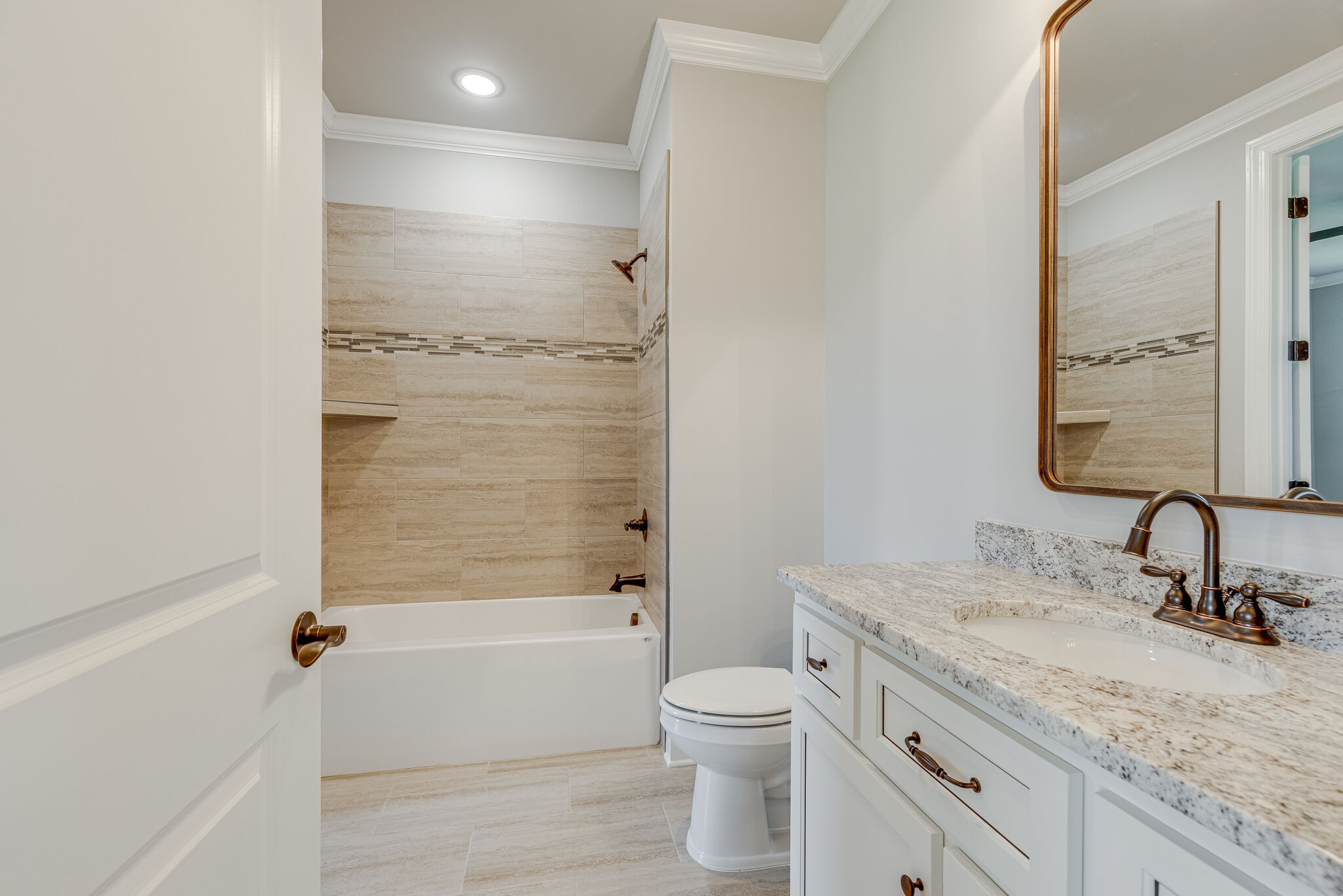 1029 Abbey Rd Way Spring Hill, TN 37174 - Photo 24 of 51 a bathroom with a granite countertop sink a toilet and shower