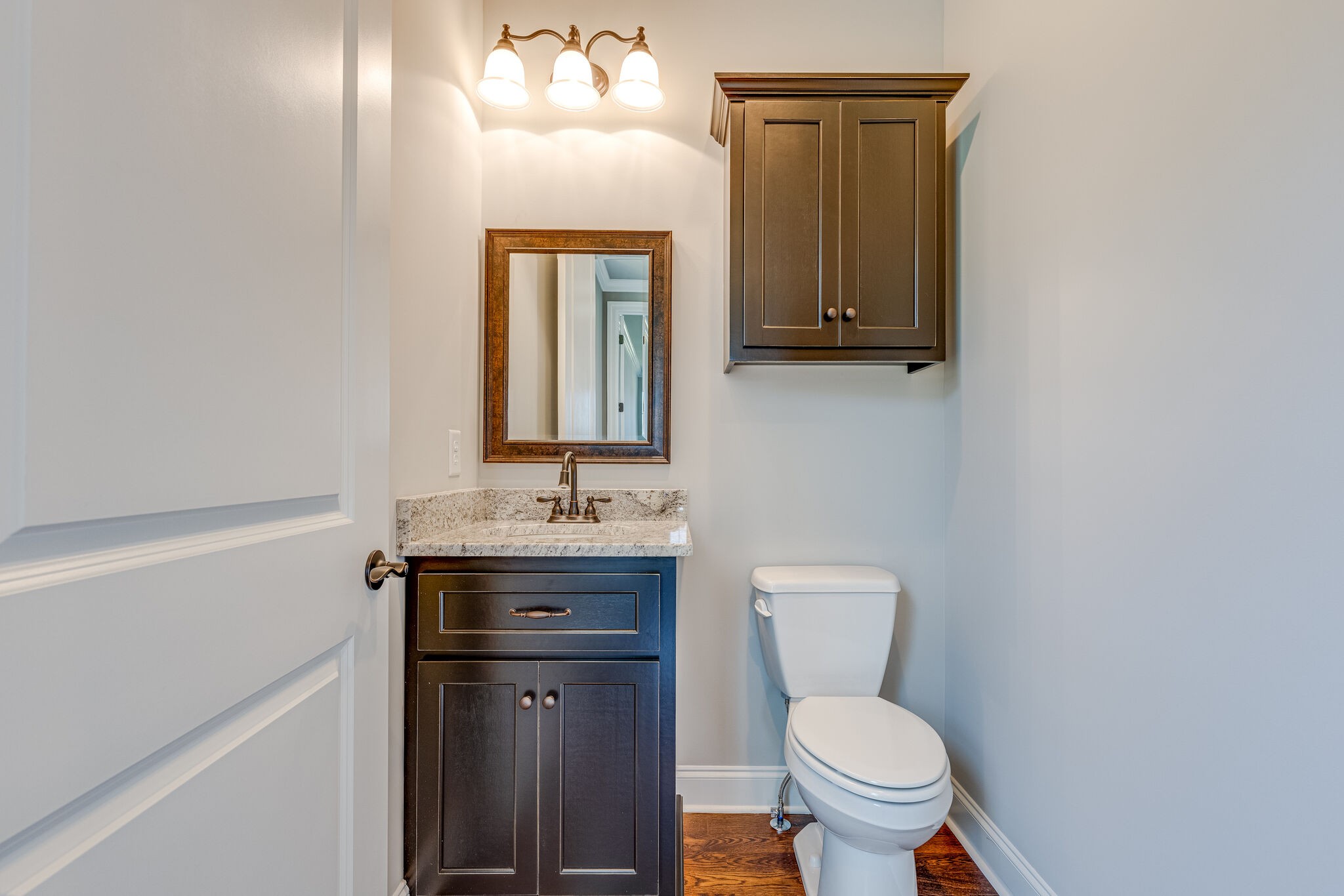 1029 Abbey Rd Way Spring Hill, TN 37174 - Photo 27 of 51 a bathroom with a toilet sink and mirror
