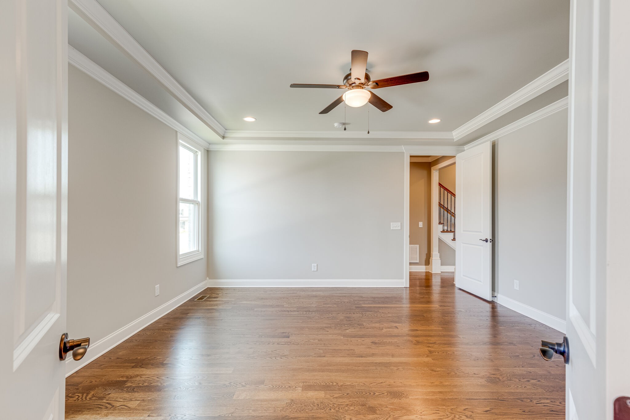 1029 Abbey Rd Way Spring Hill, TN 37174 - Photo 29 of 51 a view of an empty room with wooden floor and a window