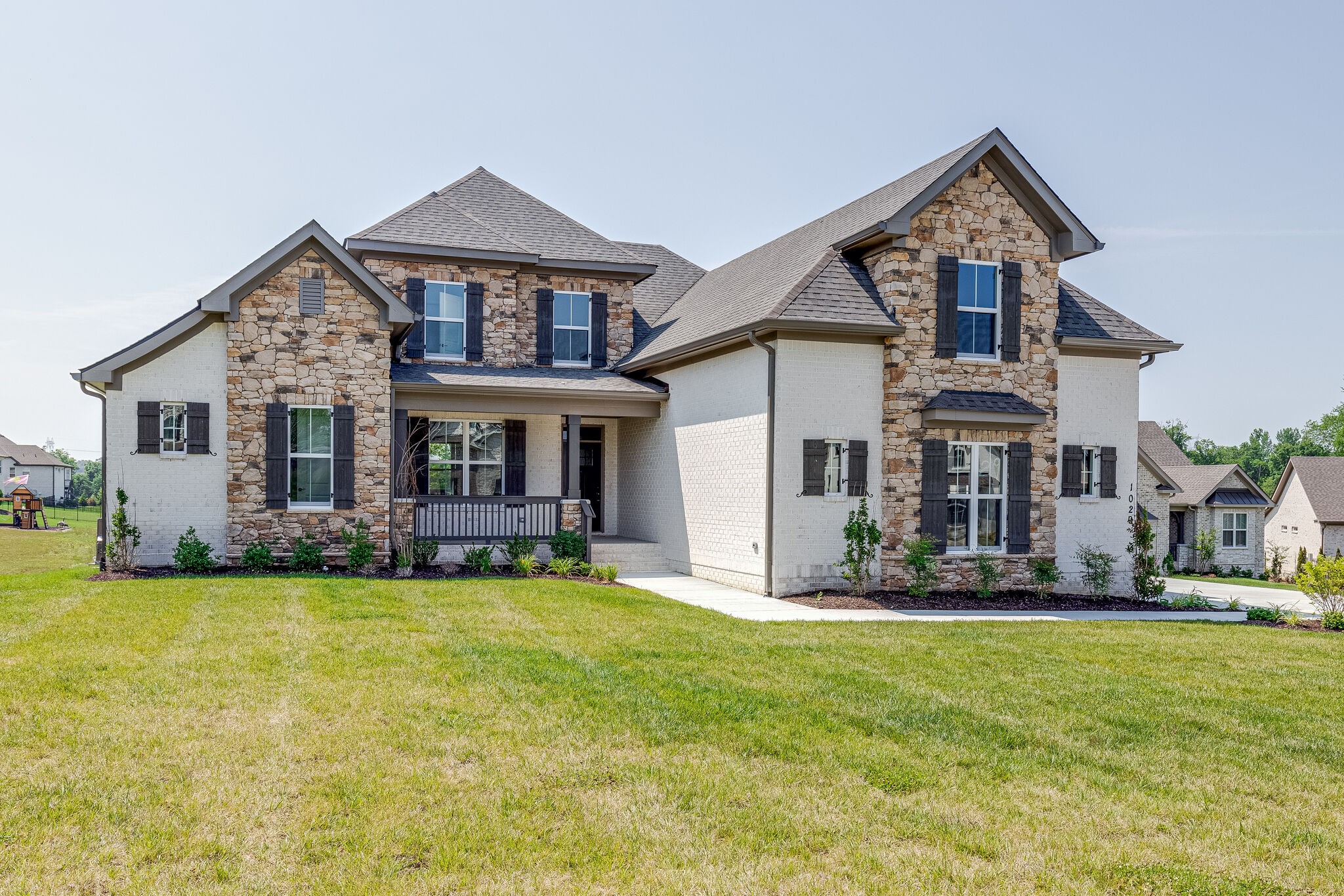 1029 Abbey Rd Way Spring Hill, TN 37174 - Photo 3 of 51 a front view of a house with a yard