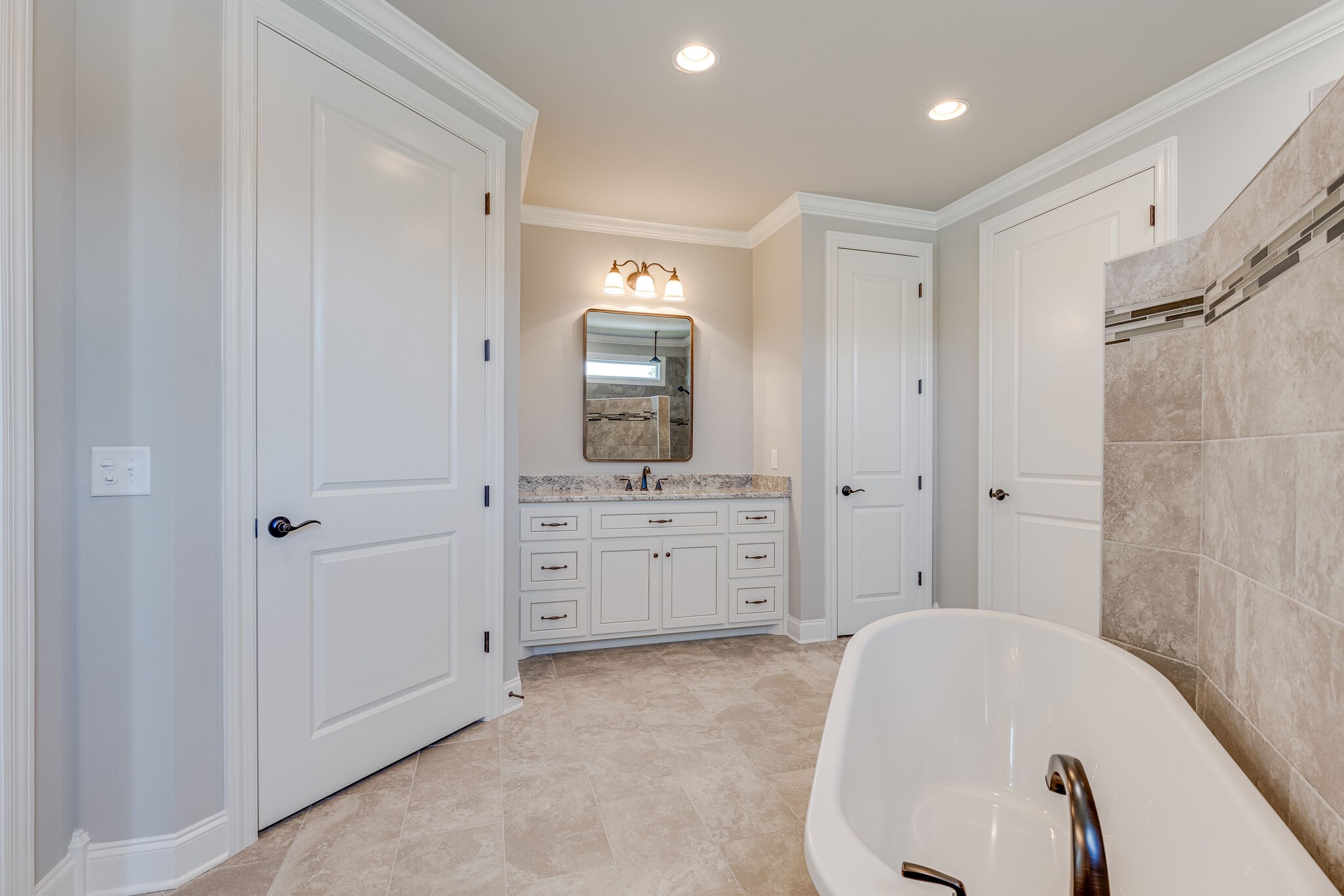 1029 Abbey Rd Way Spring Hill, TN 37174 - Photo 32 of 51 a bathroom with a tub sink and mirror