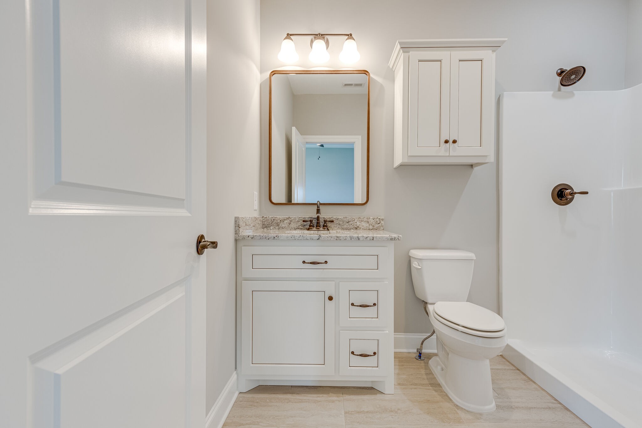 1029 Abbey Rd Way Spring Hill, TN 37174 - Photo 39 of 51 a bathroom with a toilet sink vanity and mirror