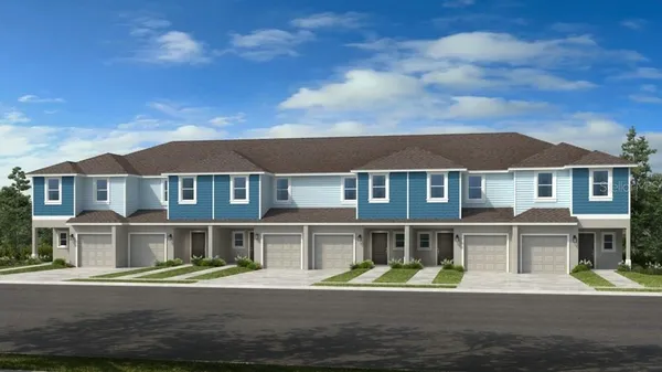 a front view of residential houses with yard