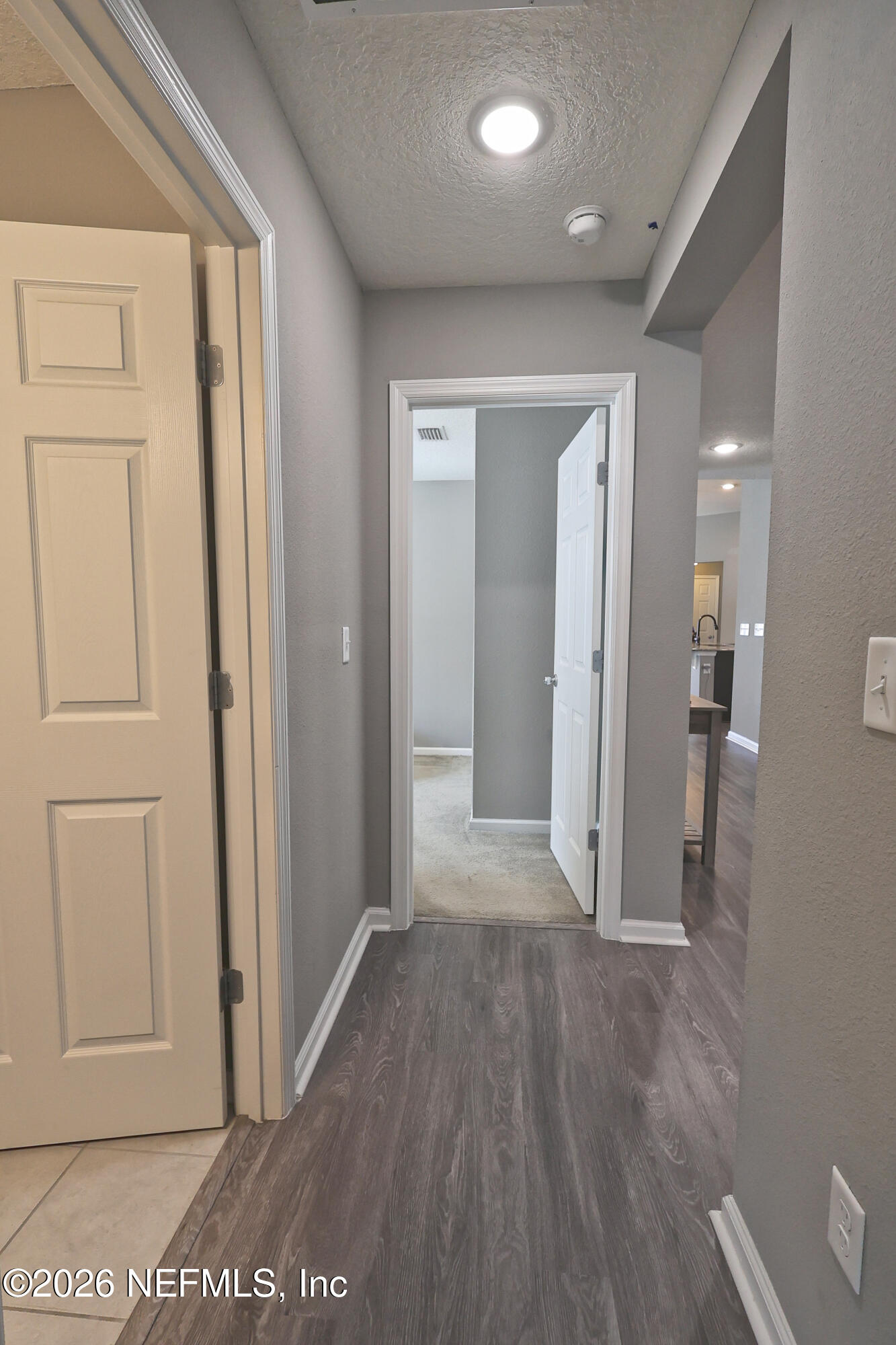 97569 Albatross Drive Yulee, FL 32097 - Photo 27 of 41 hallway bedroom 2 and 3 and hall bath