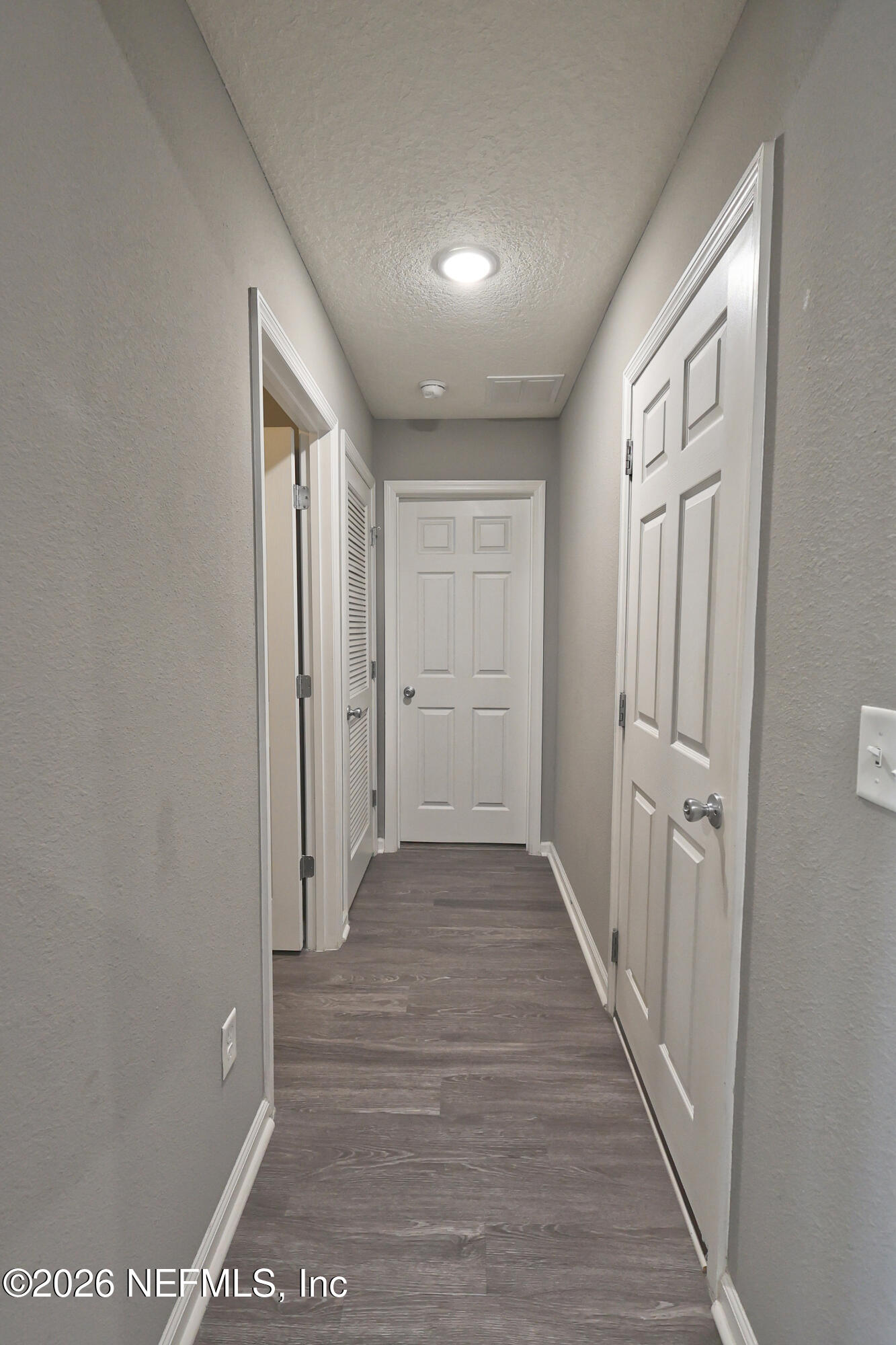 97569 Albatross Drive Yulee, FL 32097 - Photo 32 of 41 hallway to laundry garage and bedroom 4