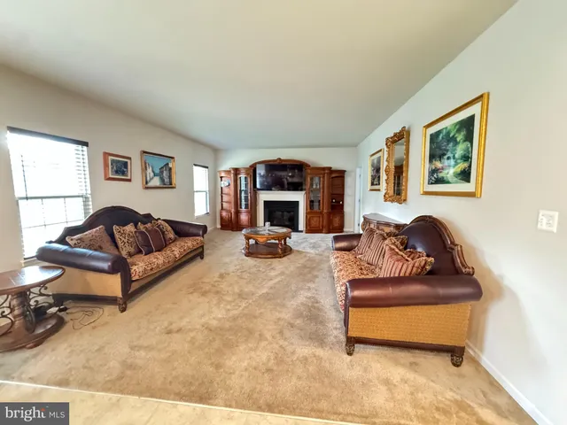 a living room with furniture window and a lamp