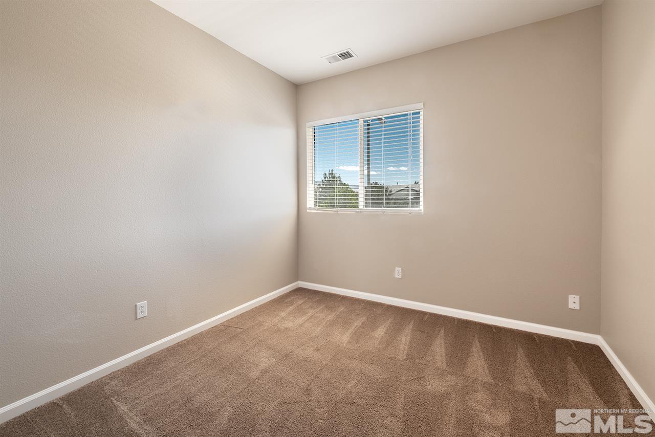 10576 Iron Point Circle Reno, NV 89521 - Photo 17 of 26 a view of an empty room with a window