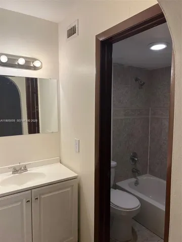 a bathroom with a sink and a toilet