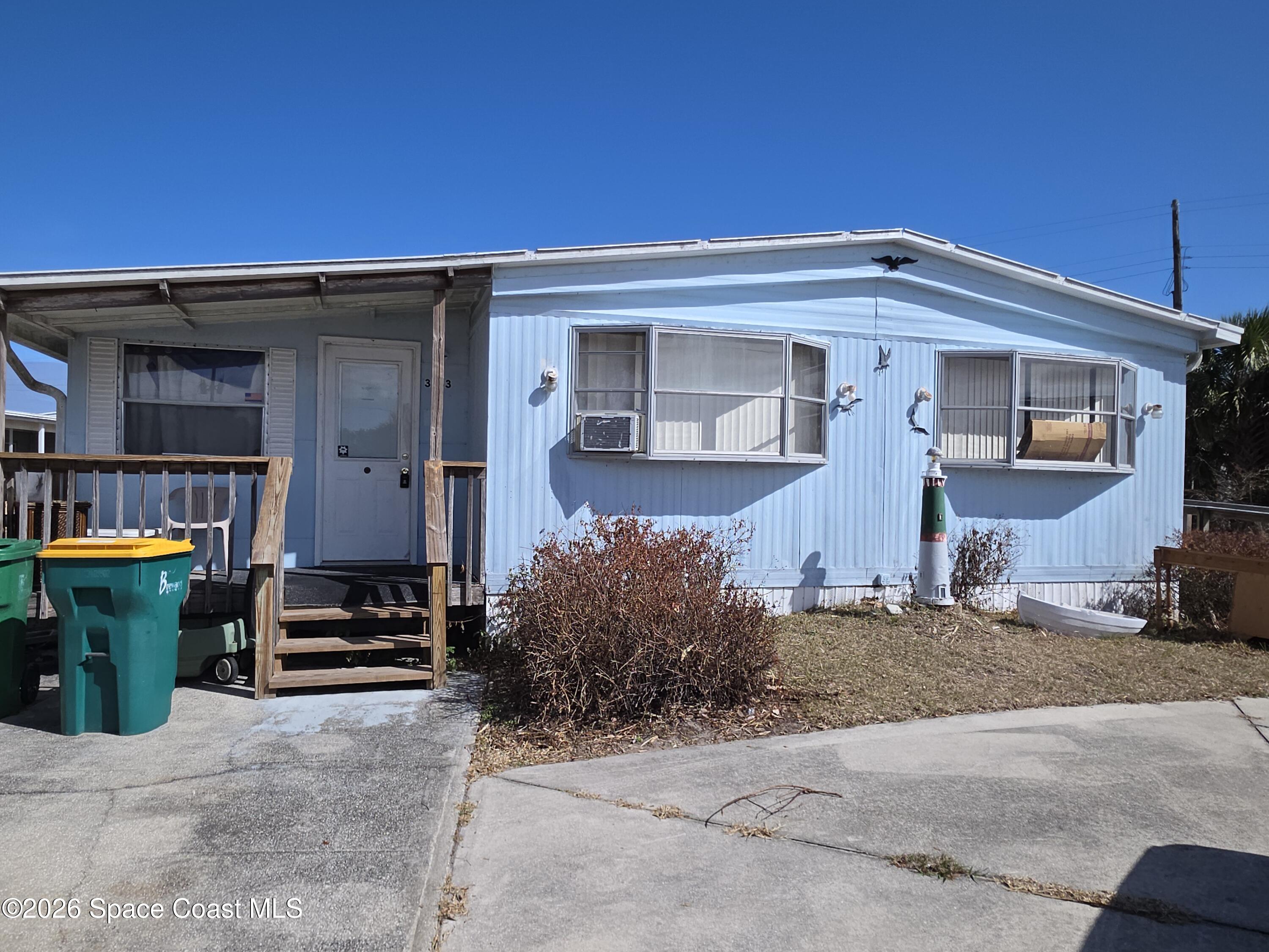 a front view of a house with parking space