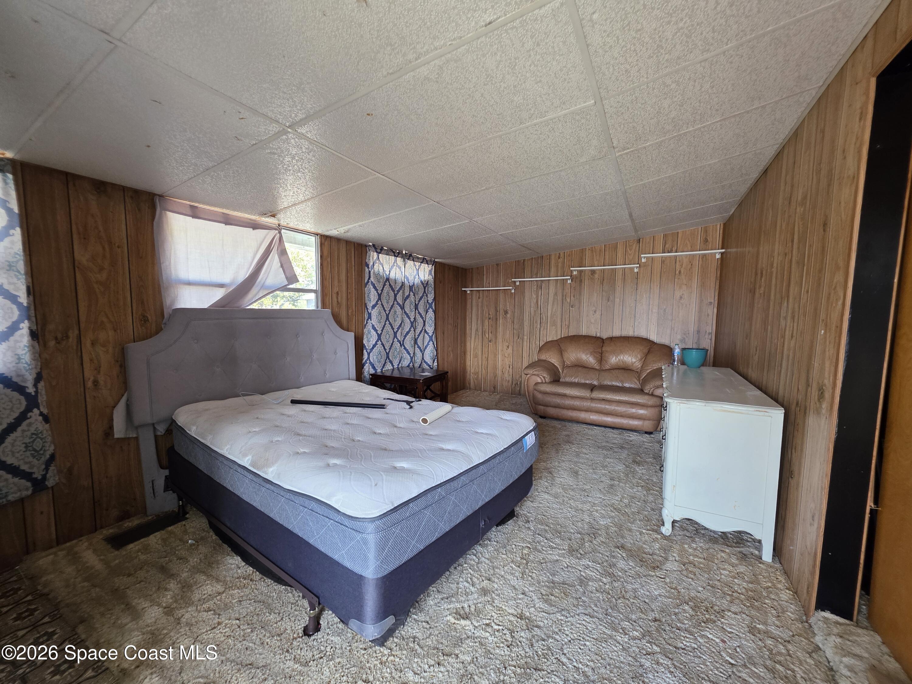 3253 Broughton Avenue Mims, FL 32754 - Photo 2 of 4 a spacious bedroom with a bed and window